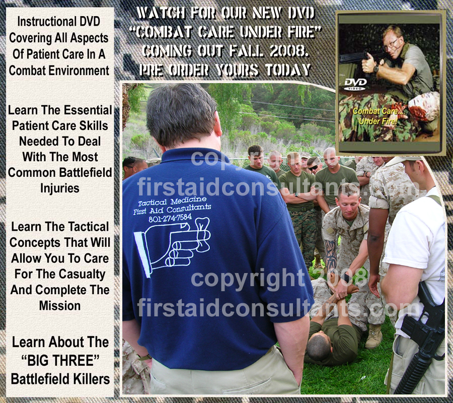 USMC Snipers during a tactical medicine training exercise taking care of soldier with simulated leg injury.